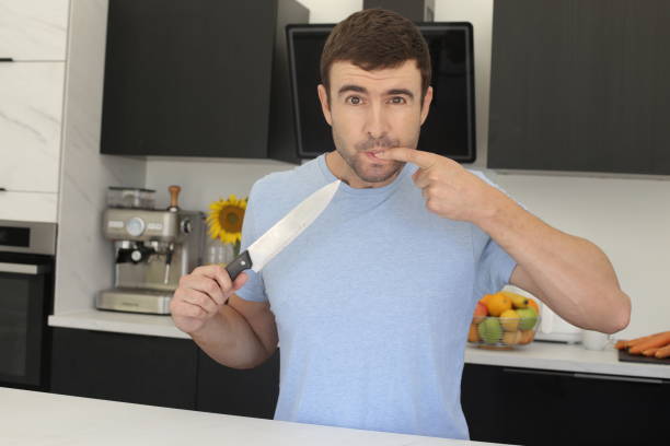 istock Man having a small accident in the kitchen 1436188214
