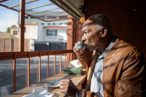 older man drinking coffee