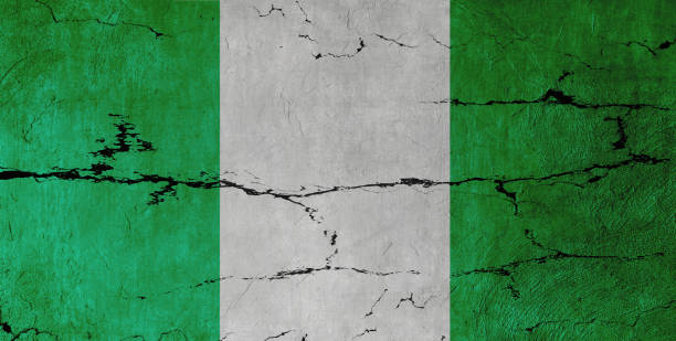 Nigeria Flag on cracked wall background.