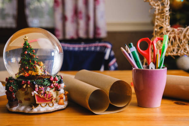 istock Christmas snow globe on the desk 1436198161