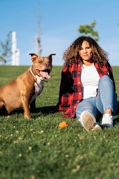 istock African Woman with Cute Dog 1436198527