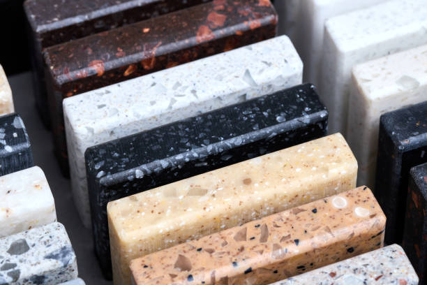 istock Porcelain stoneware square samples laid on kitchen countertop as examples of future kitchen fasade exterior. Samples slabs of natural granite marble quartz for stone countertops close up. 1436198659
