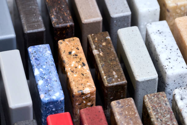 istock Porcelain multicolored stoneware square long samples as kitchen countertop examples of future kitchen fasade exterior. Samples slabs of natural granite marble quartz for stone countertops close up. 1436198664