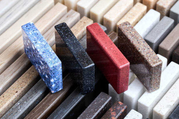 istock Porcelain four stoneware square samples laid on kitchen countertop examples of future kitchen fasade exterior. Samples slabs of natural granite marble quartz for stone countertops close up. 1436198670