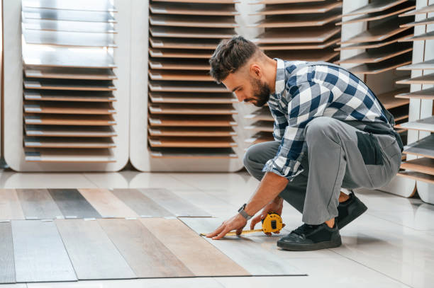 istock Man in grey uniform is with parquet indoors 1436200542