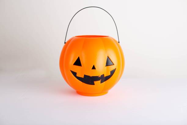 istock Small pumpkin bucket for Halloween isolated on a white background 1436200544