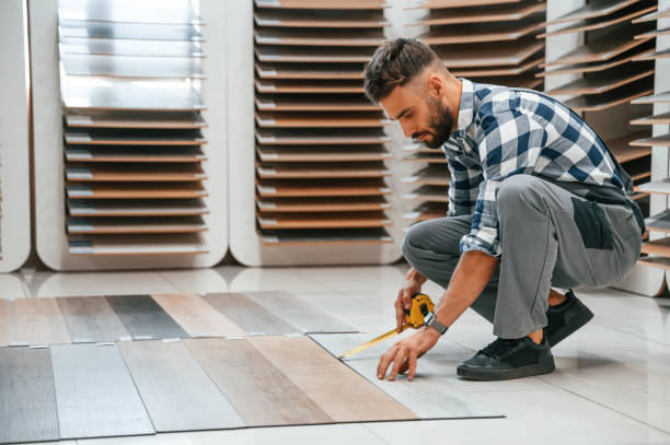 istock Man in grey uniform is with parquet indoors 1436200562