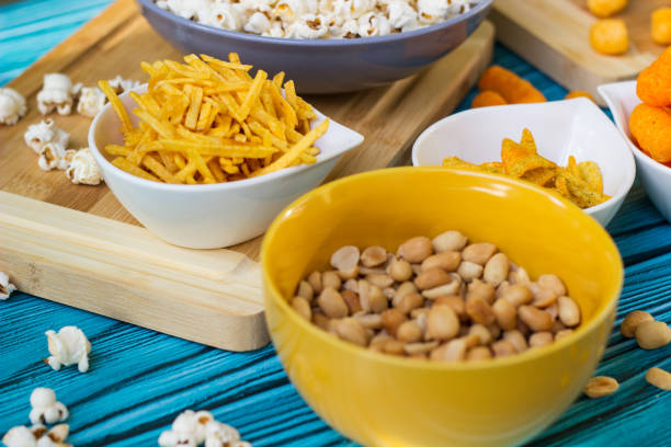 istock Beer salty snacks on wooden table 1436202379