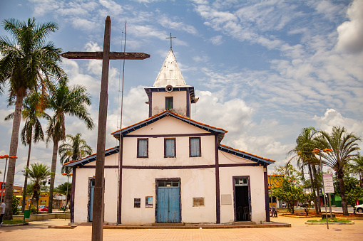 Aparecida de Goiânia, Goias, Brazil – October 23, 2022: Nossa Senhora Aparecida Sanctuary, with a huge wooden cross in front, on a cloudy day.