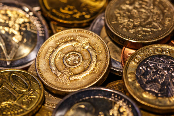 istock United kingdom Pound coin.British coins stack on black, pound sterling,Business concept.Numismatics. Iron money.Collection 1436206481