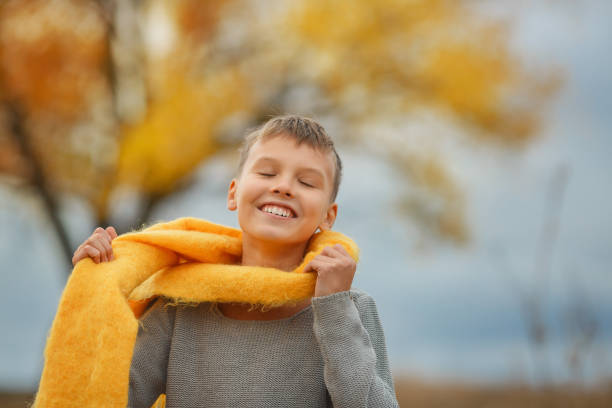 istock Kid standing in grey stormy autumn day. 1436206819
