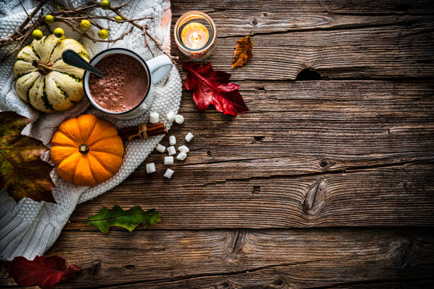 istock Hot chocolate mug with Autumn decoration on rustic table. Copy space 1436207045