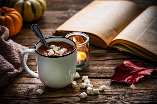 istock Hot chocolate with marshmallows, Autumn or Thanksgiving decoration on rustic table 1436207054