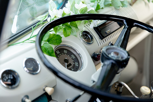 Beautiful vintage wedding car about to take a bride to get married