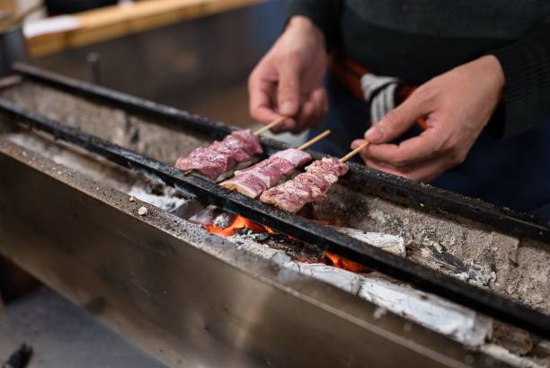 istock Broiling pieces of pork on charcoal fire 1436208055