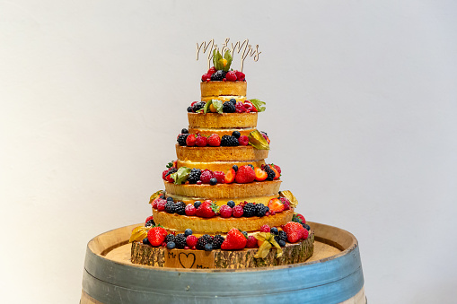 Wedding sponge cake with floral decorations at a beautiful marriage celebration