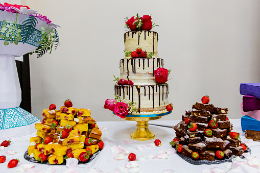 Wedding cake table with floral decorations at a beautiful marriage celebration