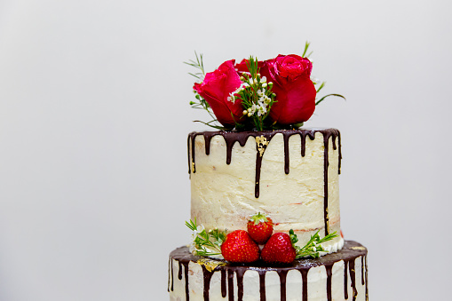 Wedding chocolate cake with floral decorations at a beautiful marriage celebration