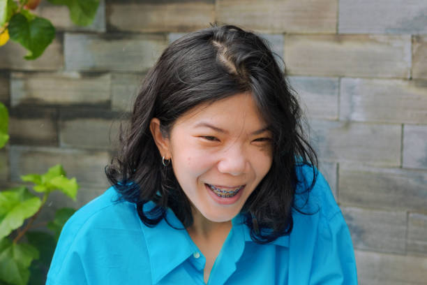 istock Happy laughing young Thai woman 1436208519