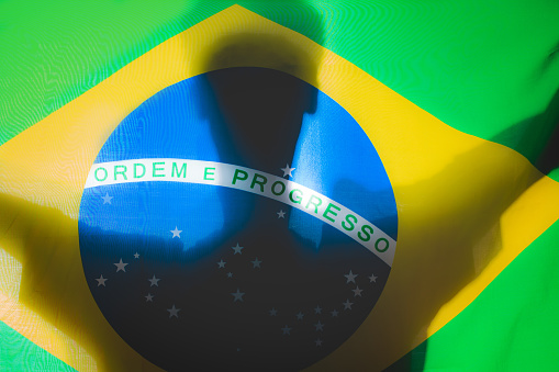 Brazilian Power - Silhouette on the Brazilian Flag Concept Brazilian Strength