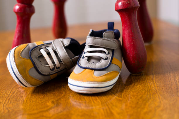 istock LV Toddler size shoes sitting beside a small red stool. 1436212257