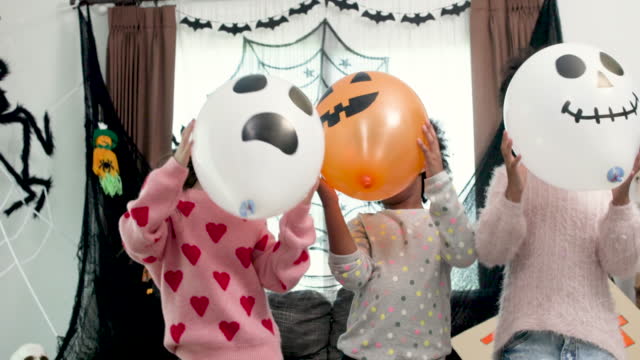 Slow-motion Children having fun at a Halloween party , Halloween Dance
