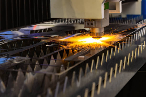 istock Laser cutting machine for metal sheet with melted metal sparks 1436214203