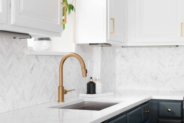 istock A gold kitchen sink detail shot in a beautiful kitchen. 1436216681