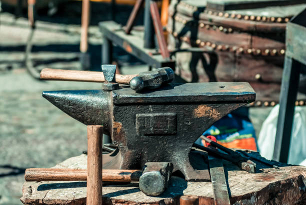 istock Blacksmith's hammer on a metal anvil in forge 1436216691