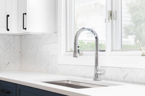istock A kitchen sink detail shot with a herringbone backsplash. 1436216871