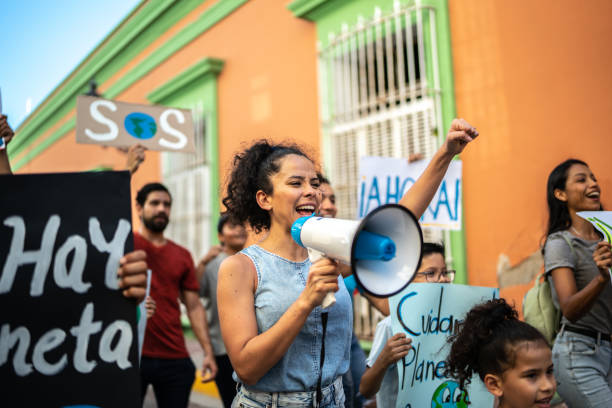 istock Mid adult woman leading a protest using a megaphone 1436218256