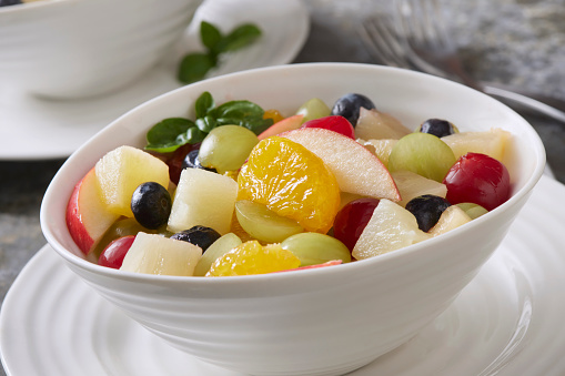 Fruit Salad with Mandarin Oranges, Grapes, Pineapple, Pears, Blueberries, Maraschino Cherries and Fresh Basil