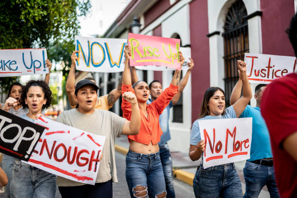 Protesters holding signs on the protest outdoors