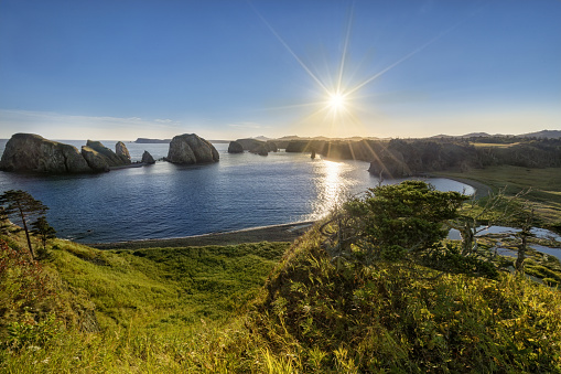 In the unnamed bay on the island of Shikotan, Kuril Islands. Bright sunrise.