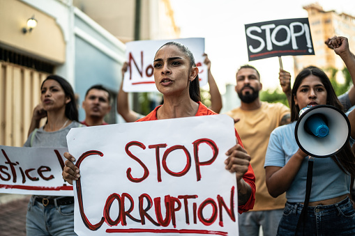Protesters doing a demonstration against the corruption
