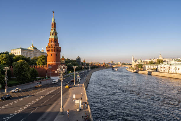 View The Kremlin, Moscow river, ships and embankment in Moscow ,Russia. Moscow, Russia- May 09,2022: Landscape of Moscow ,Russia, with The Kremlin, Moscow river, ships and embankment at sunset time. moscow stock pictures, royalty-free photos & images