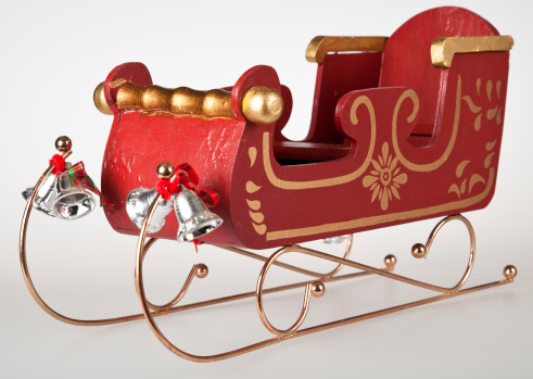 Classic Wooden toy Santa Sleigh, with gold trimmings, and silvers bells.