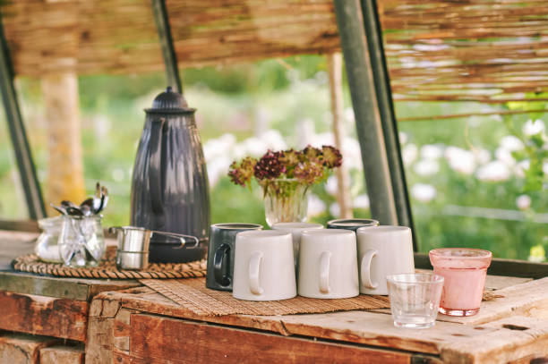 istock Sunny rustic kitchen with tea cups, old wooden table 1436226757