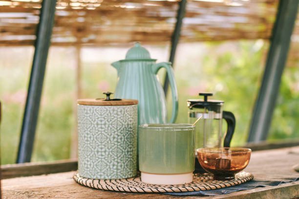 istock Sunny rustic kitchen with tea utensils, different shades of green color 1436226758