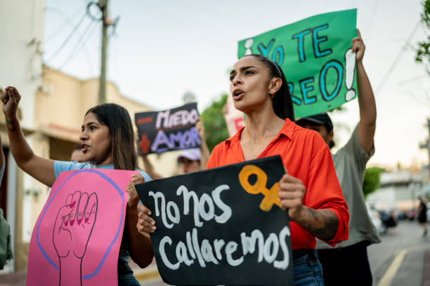 istock Protesters women holding signs during a demonstration 1436227562