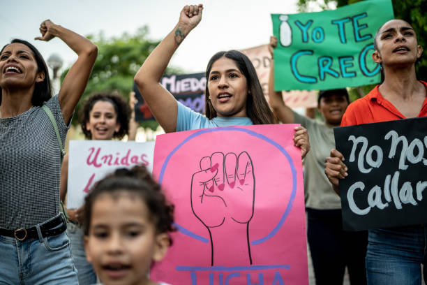 istock Protesters women holding signs during a demonstration 1436227569