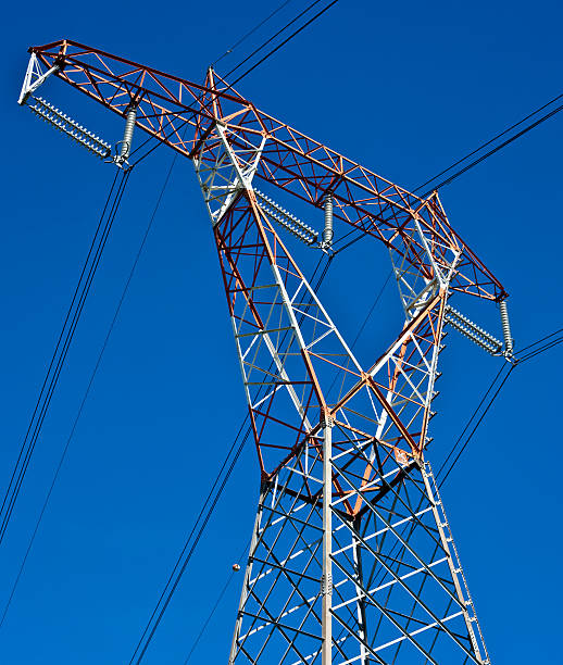 istock Electricity Pylon Against Blue Sky 143622802
