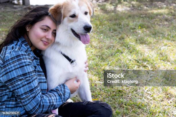 Indian Young Woman Spends Her Recharge Day From Work With Her Dog Stock Photo - Download Image Now