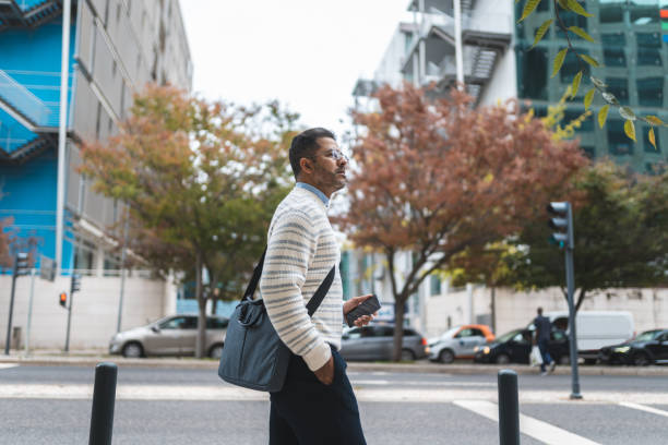 istock Businessman walking in downtown Lisbon 1436234907