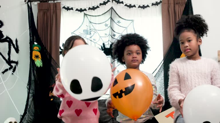 Slow-motion Children having fun at a Halloween party , Halloween Dance