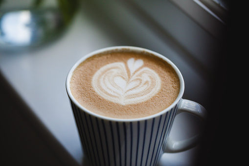 A cup of cappucino with beautiful latte art