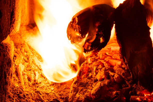 istock wood stove heating, burning wood coals 1436240095