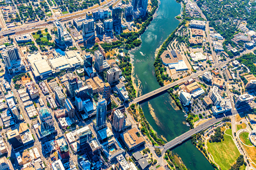 Aerial view of the buildings along the banks of the Colorado River in downtown Austin, Texas from about 3500 feet in altitude during a helicopter photo flight.
