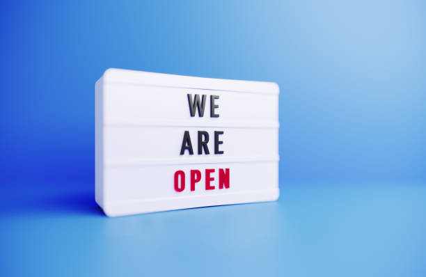 istock We Are Open Written White Lightbox Sitting On Blue Background 1436242687