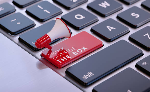 istock Red Megaphone Sitting On Think Outside The Box Written Computer Keyboard 1436244429